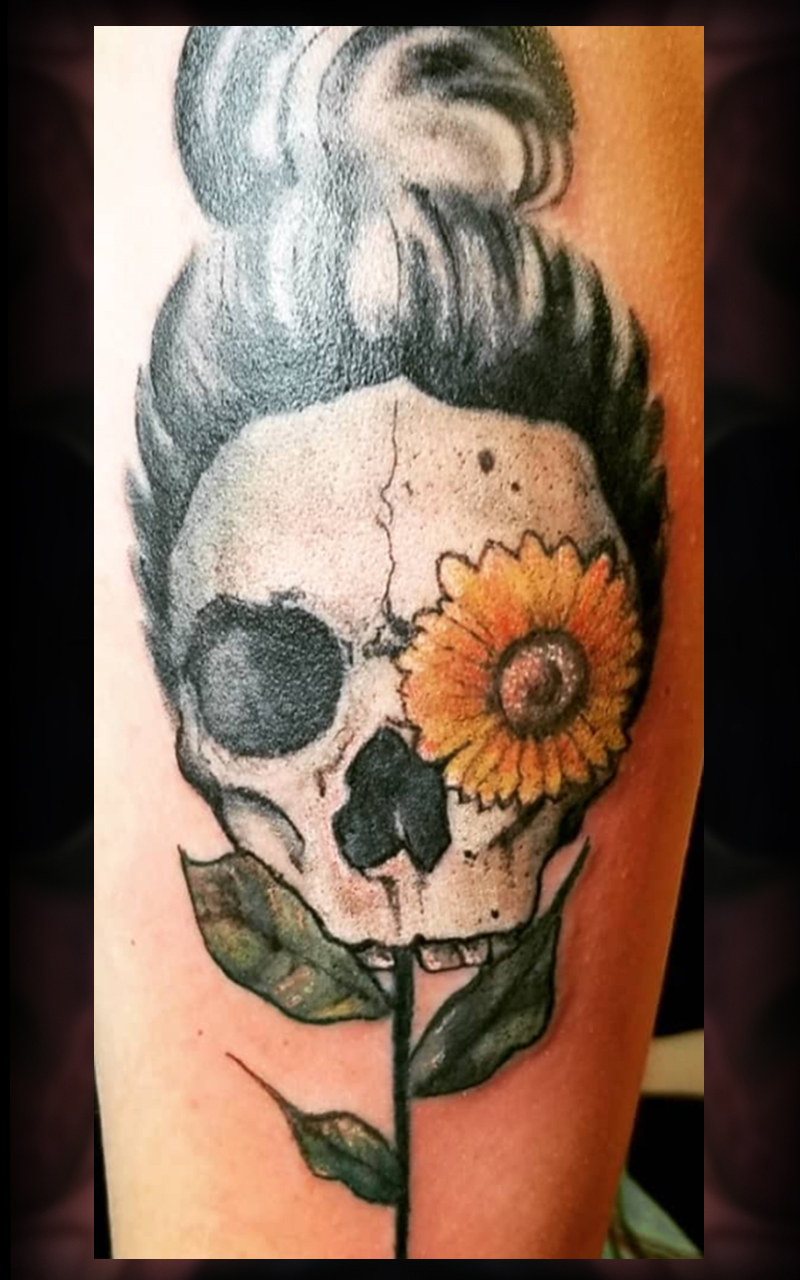 Skull with flower tattoo