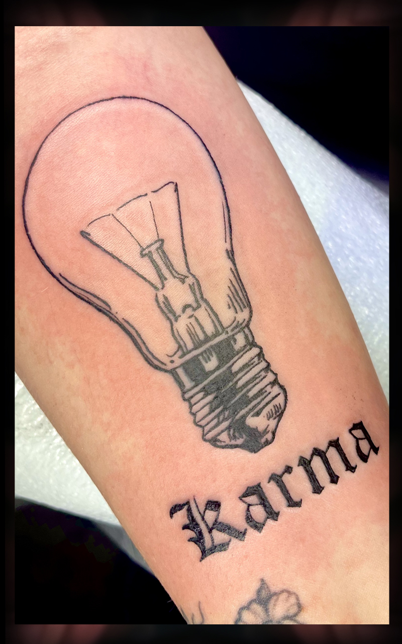 Taylor Swift Karma tattoo