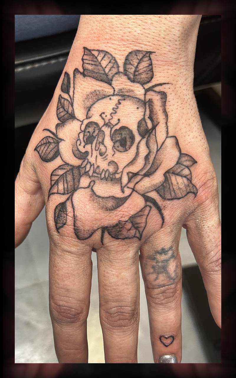 Skull on hand tattoo