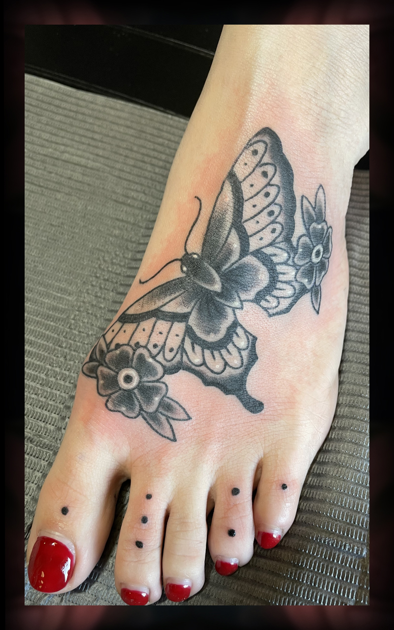 Butterfly on foot tattoo