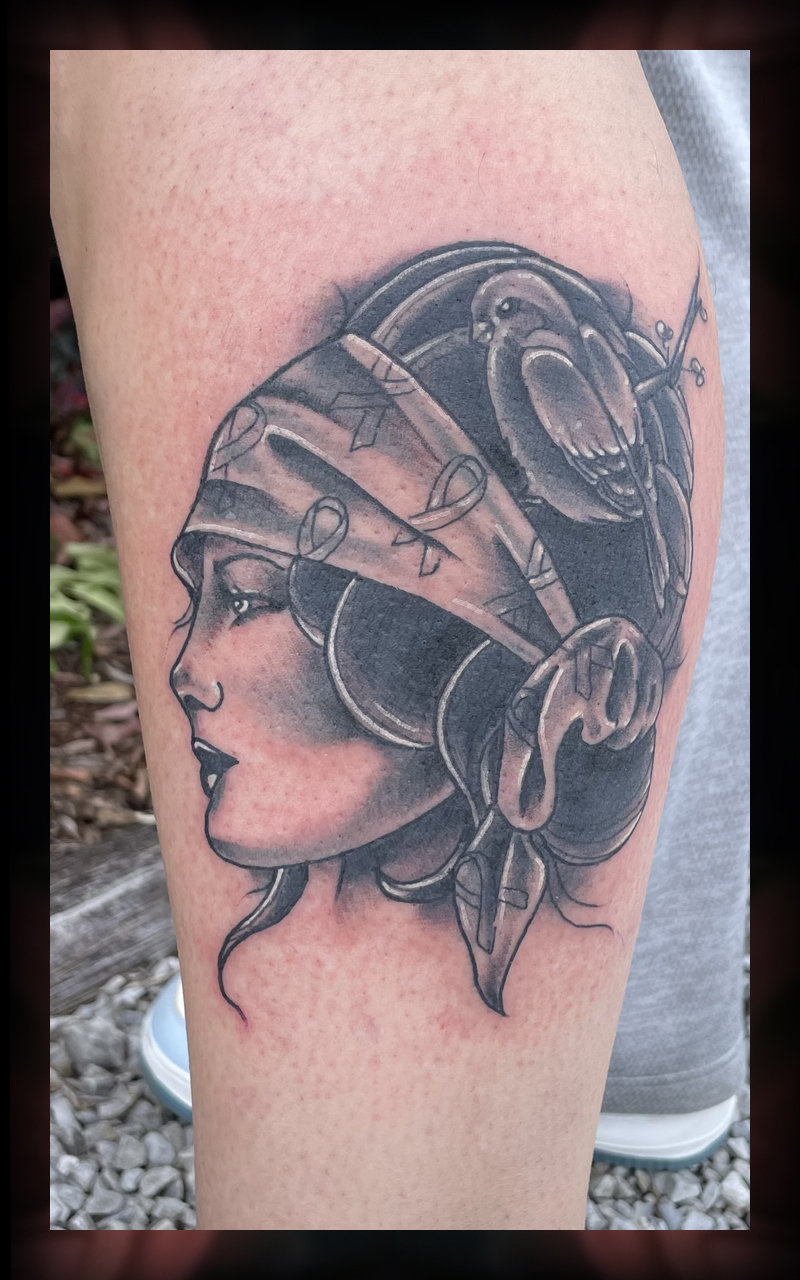 Woman with bird tattoo